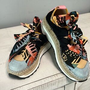 Free people sneakers perfect to wear with a nice denim dress, worn once